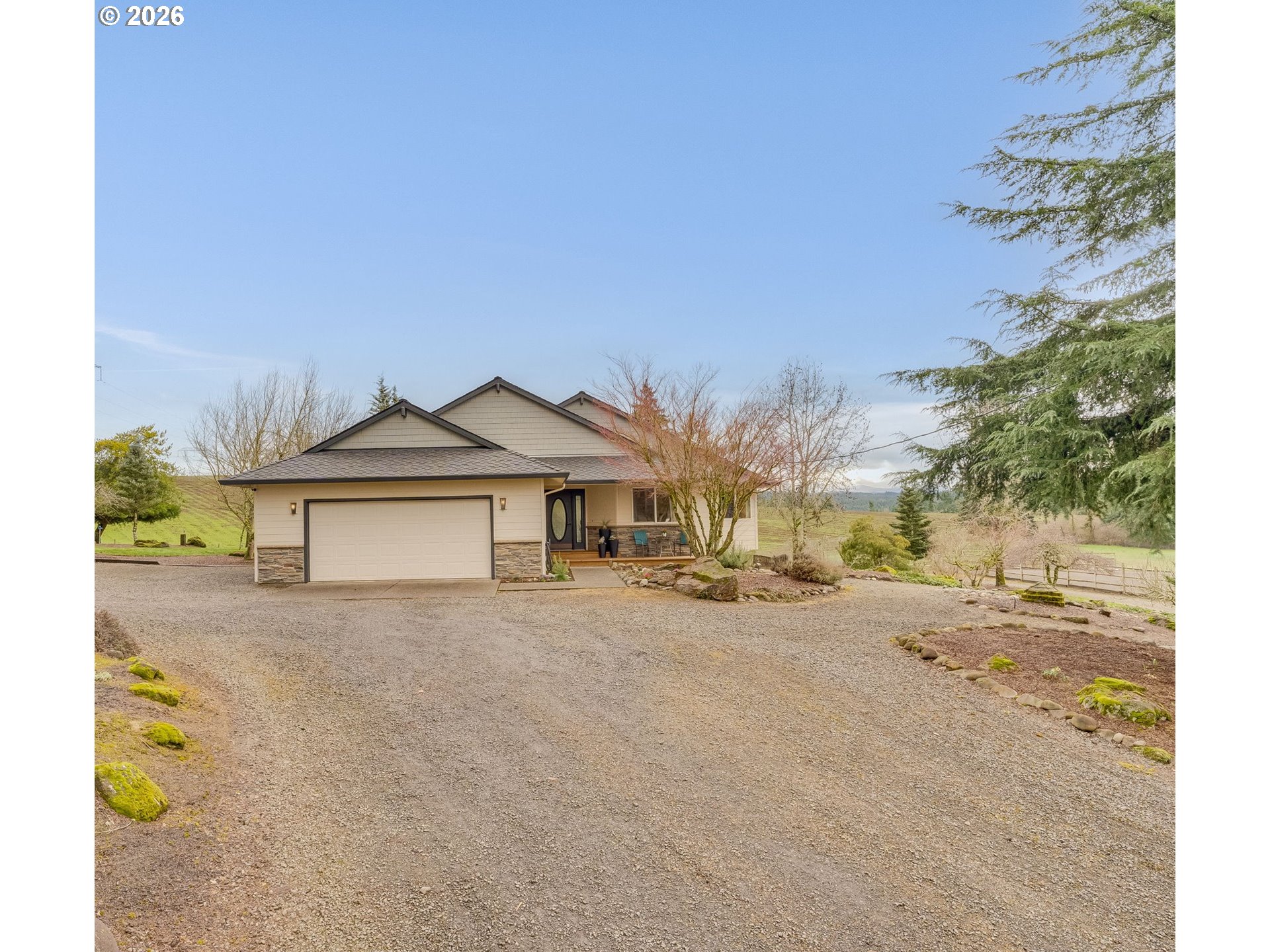 33100 Southeast Gunderson Road Boring, OR 97009 - Photo 1 of 48 a front view of a house with a yard and garage