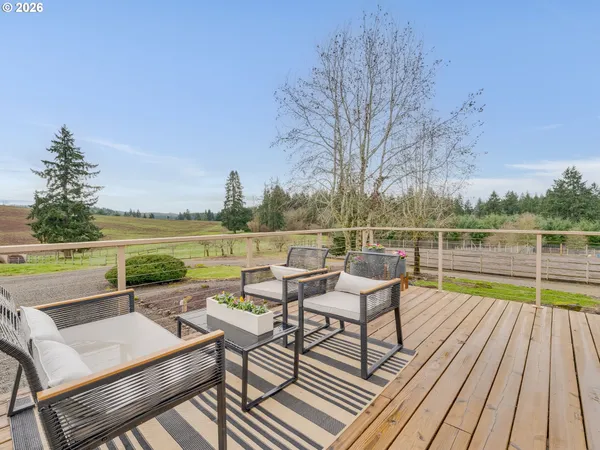 a view of deck with mountain view and wooden floor