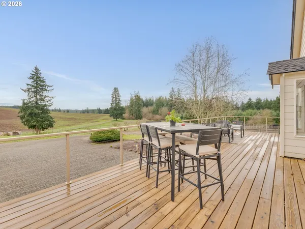 a view of a lake with outdoor seating