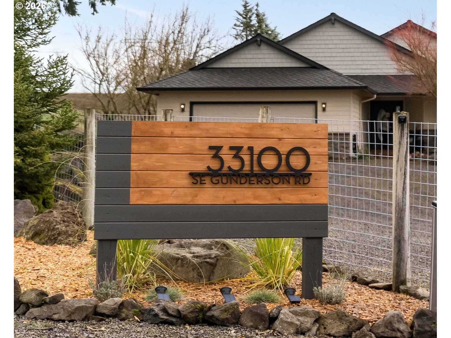 33100 Southeast Gunderson Road Boring, OR 97009 - Photo 2 of 48 a view of a wooden door of the house