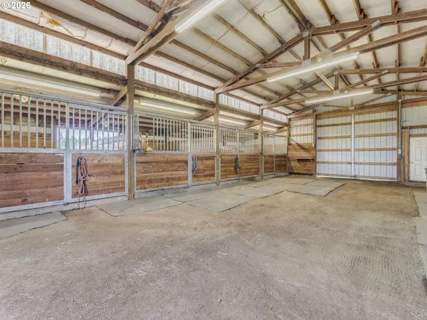 a view of an empty room with wooden roof