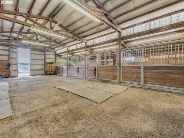a view of an empty room with wooden ceiling
