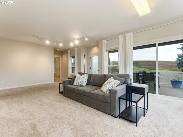 a bedroom with a bed and a couch