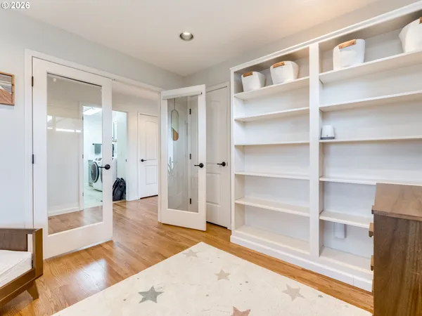 a bedroom with furniture and a window