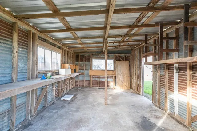 a view of an empty room with windows