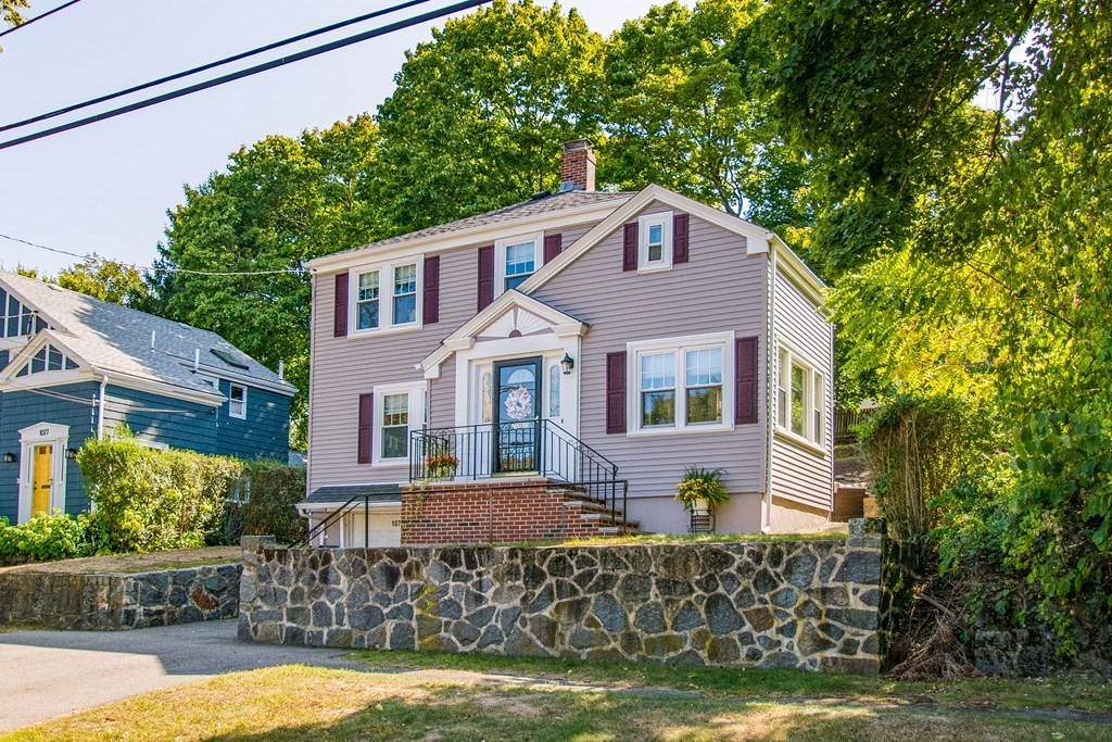 1073 Brook Road Milton, MA 02186 - Photo 1 of 30 a front view of a house with a yard
