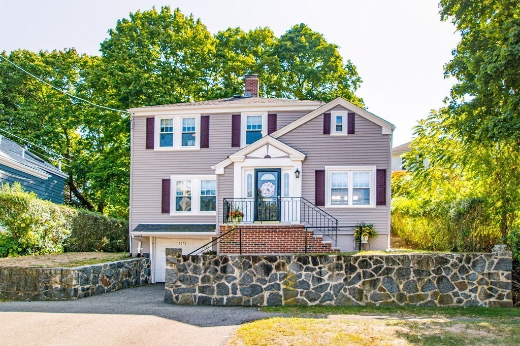 1073 Brook Road Milton, MA 02186 - Photo 2 of 30 a front view of a house with garden