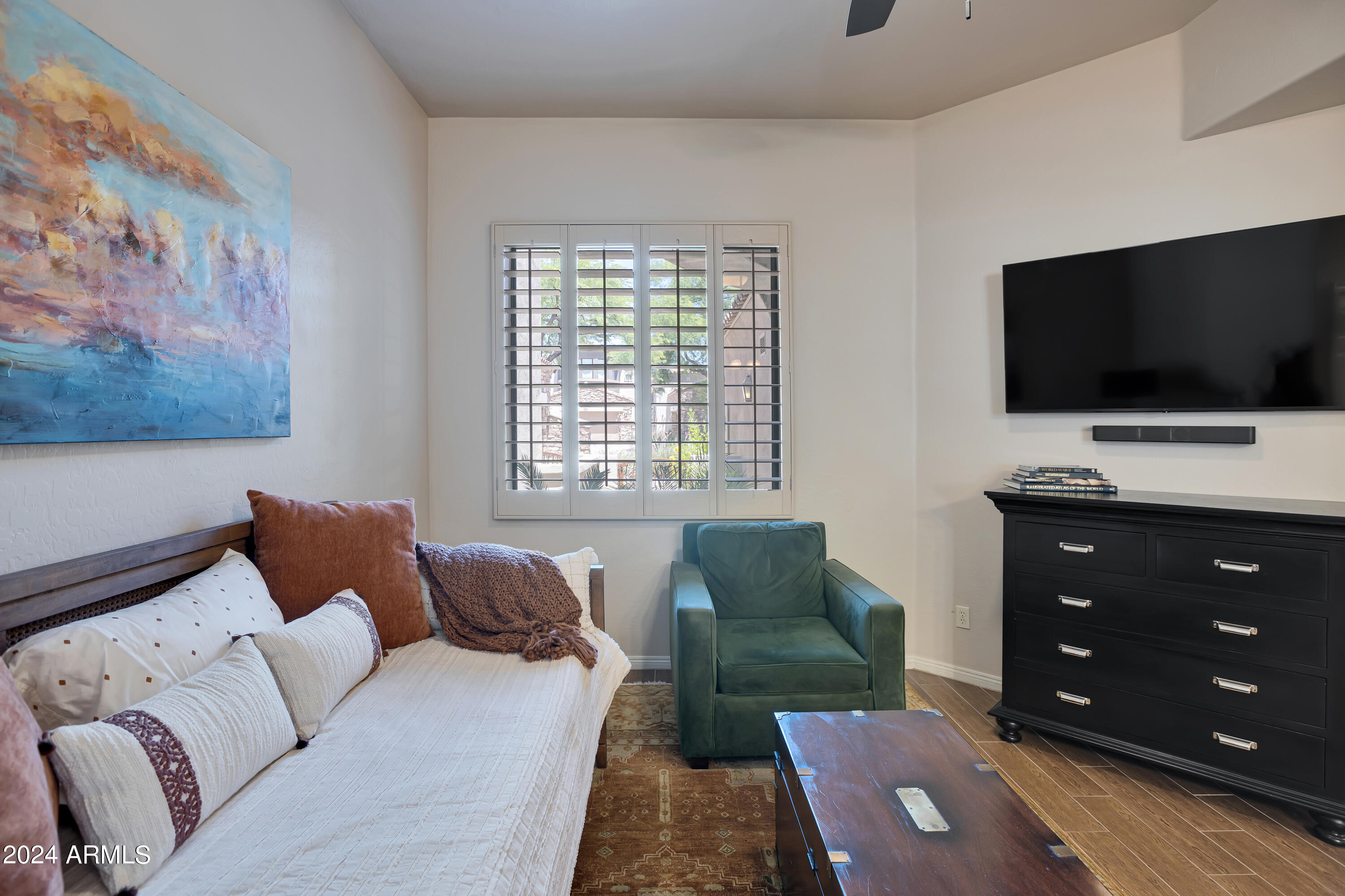 19550 North Grayhawk Drive, Unit 1137 Scottsdale, AZ 85255 - Photo 13 of 48 a living room with furniture and a flat screen tv