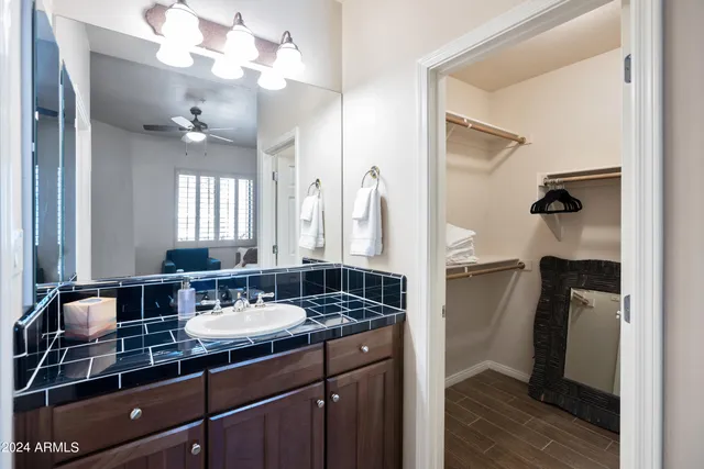 a bathroom with a sink double vanity and a mirror