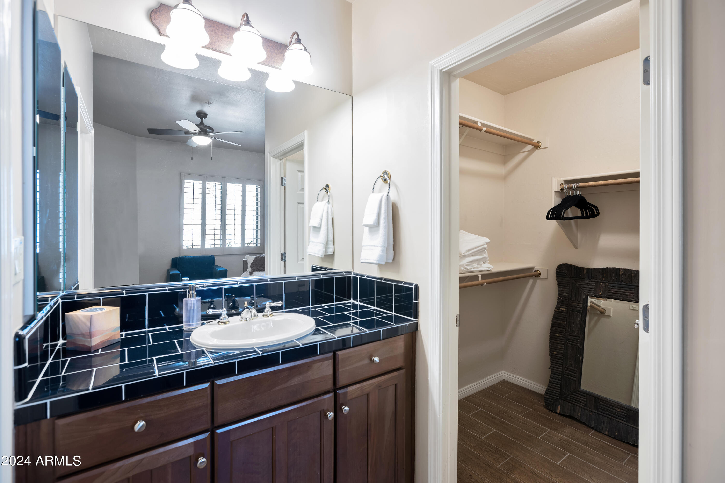 19550 North Grayhawk Drive, Unit 1137 Scottsdale, AZ 85255 - Photo 15 of 48 a bathroom with a sink double vanity and a mirror
