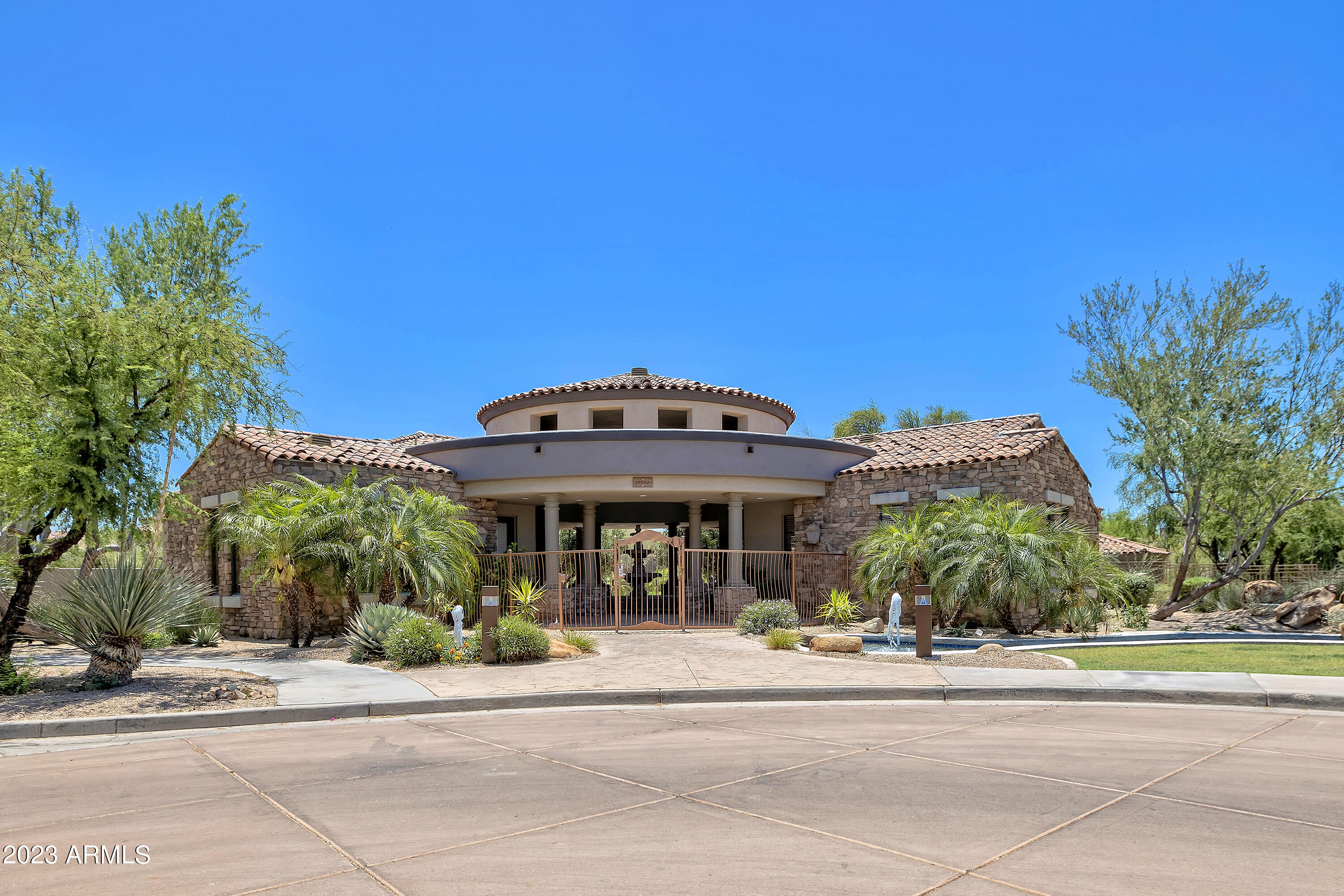 19550 North Grayhawk Drive, Unit 1137 Scottsdale, AZ 85255 - Photo 2 of 48 a front view of a building with a garden
