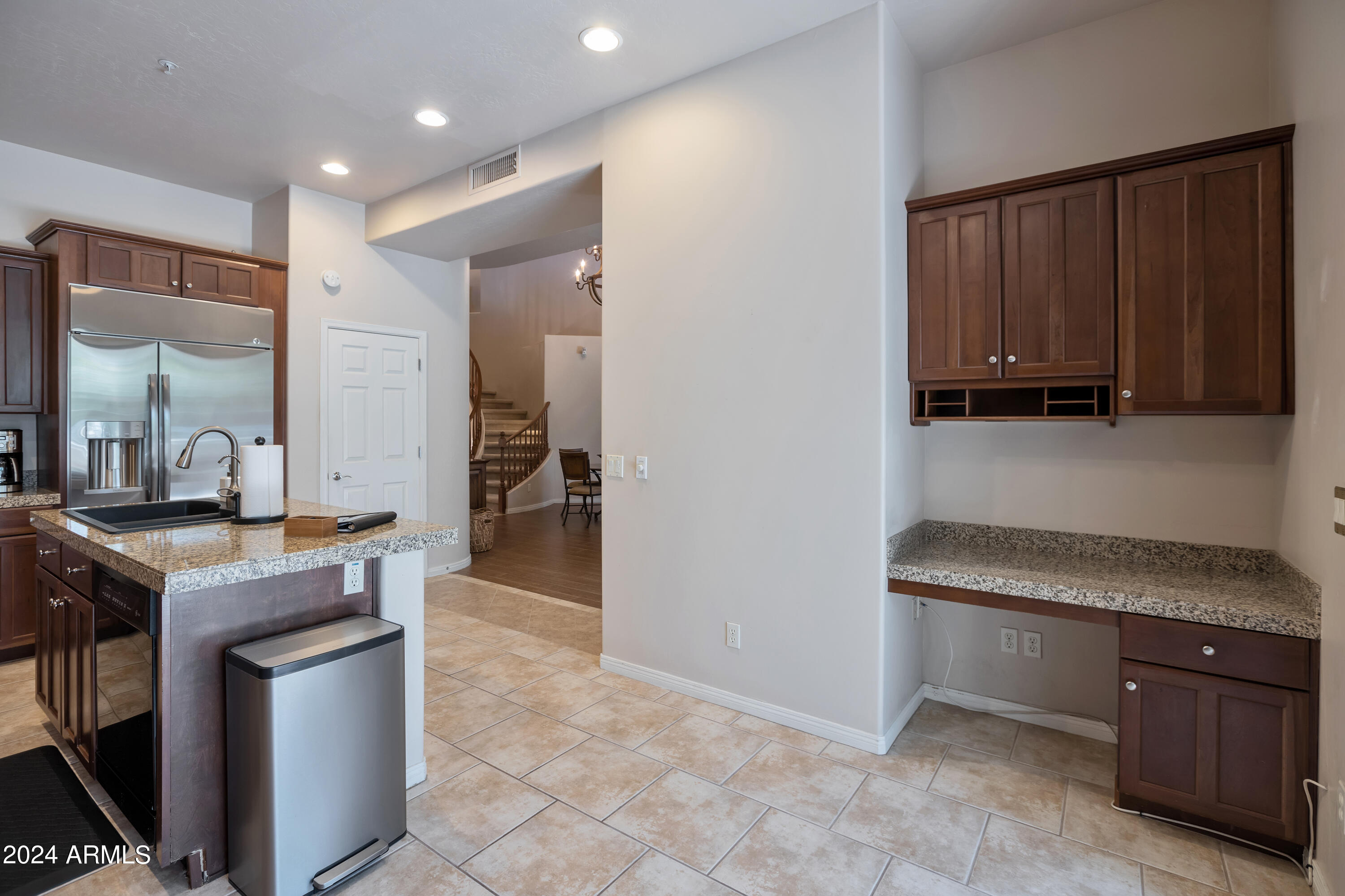 19550 North Grayhawk Drive, Unit 1137 Scottsdale, AZ 85255 - Photo 23 of 48 a kitchen with a stove a sink and a refrigerator
