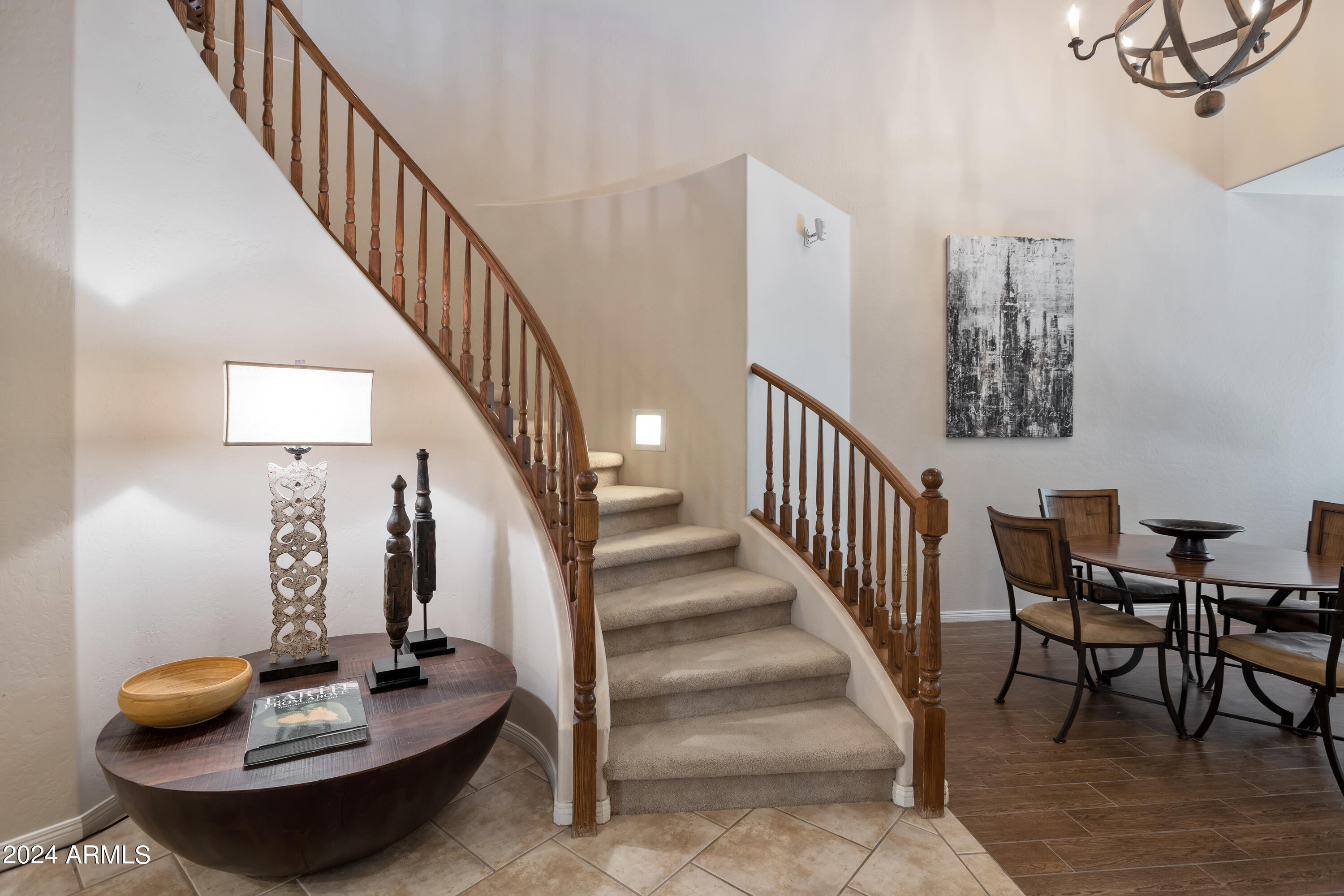 19550 North Grayhawk Drive, Unit 1137 Scottsdale, AZ 85255 - Photo 24 of 48 a dining room with furniture and wooden floor