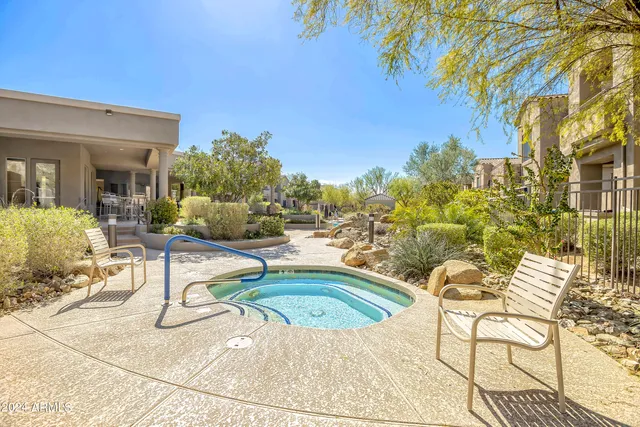 a view of a swimming pool with a lounge chairs