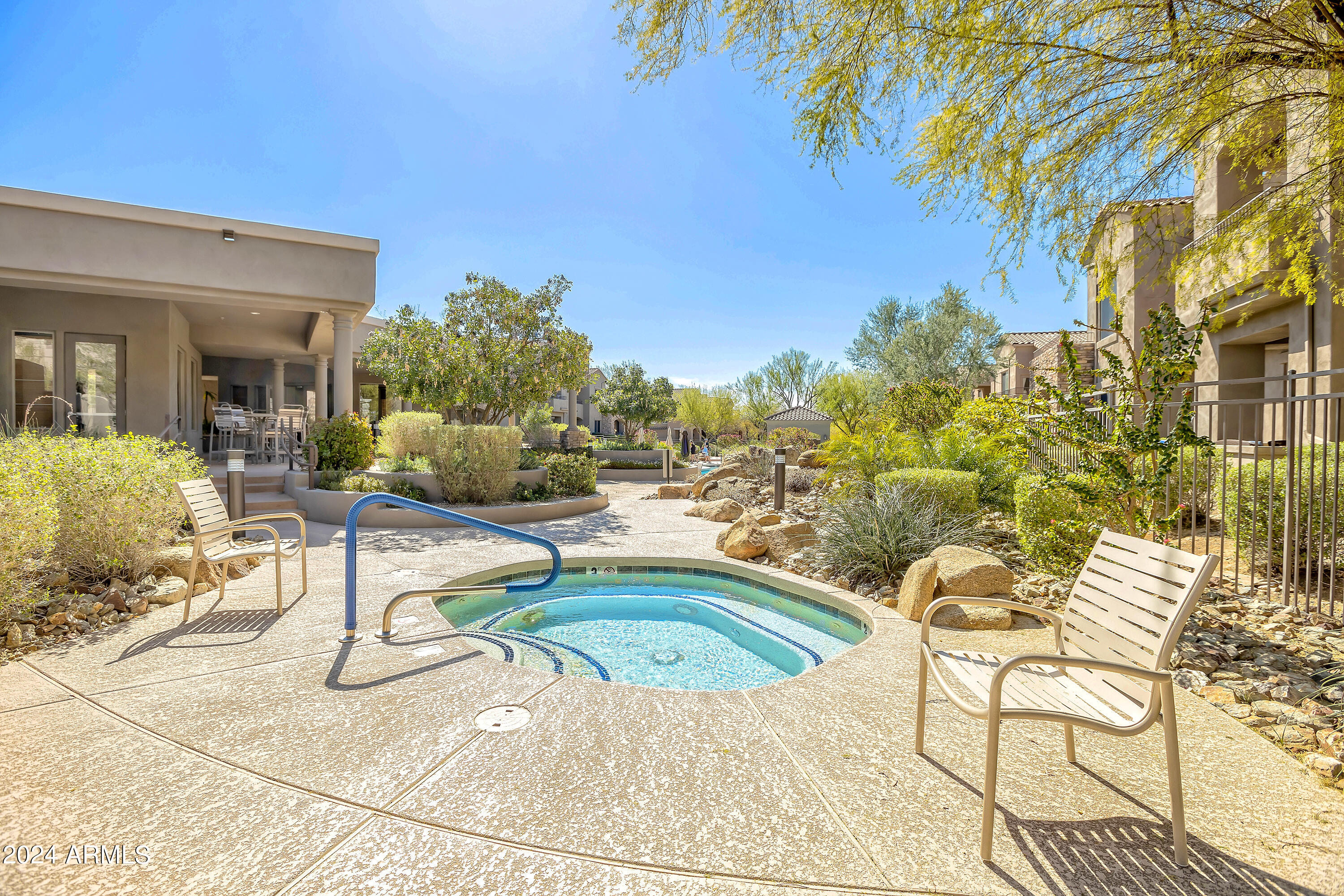 19550 North Grayhawk Drive, Unit 1137 Scottsdale, AZ 85255 - Photo 41 of 48 a view of a swimming pool with an outdoor seating