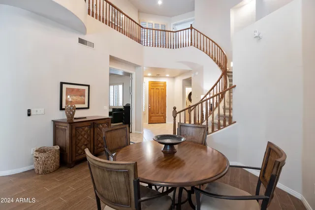 a view of a livingroom with furniture a table and chair