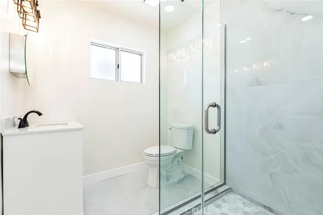 a bathroom with a shower and sink