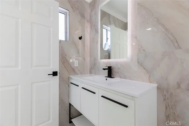 a bathroom with a sink and a mirror
