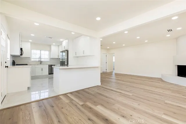 a view of kitchen view wooden cabinets and kitchen view
