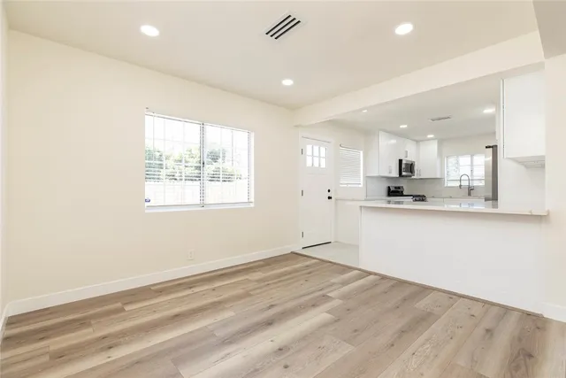 a view of kitchen with wooden floor