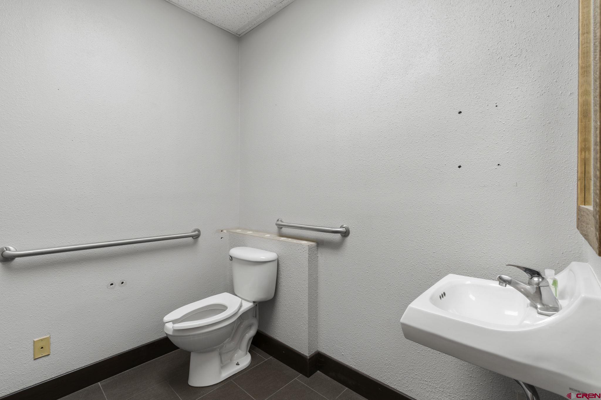 3206 Main Avenue, Unit 4 Durango, CO 81301 - Photo 11 of 18 a bathroom with a toilet sink and mirror