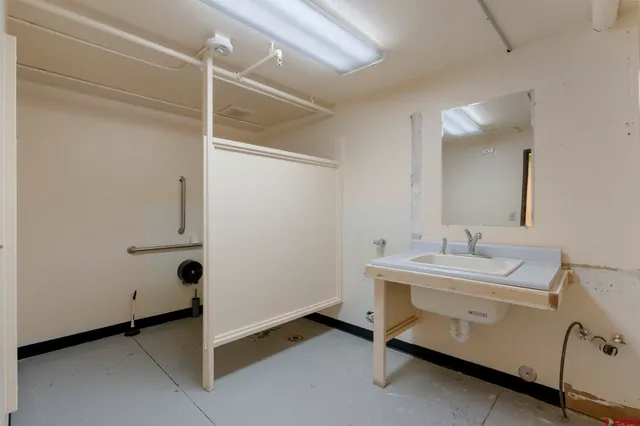 a view of a hallway with stairs