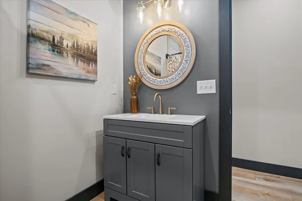 a bathroom with a sink and a mirror