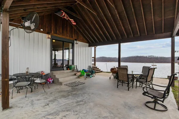 a view of a chairs and table in patio