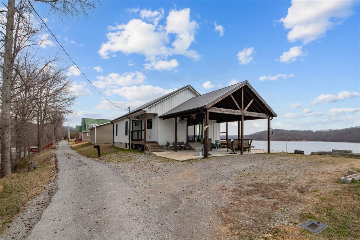 269 Paradise Lane Stewart, TN 37175 - Photo 26 of 31 a view of a house with a yard and sitting area