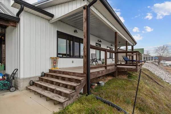 a view of a house with pool and wooden floor