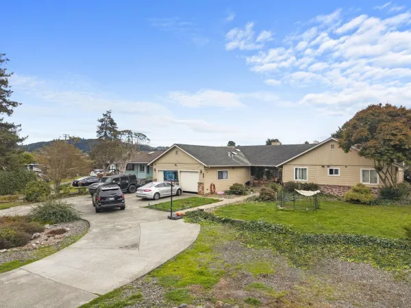 a front view of a house with a yard