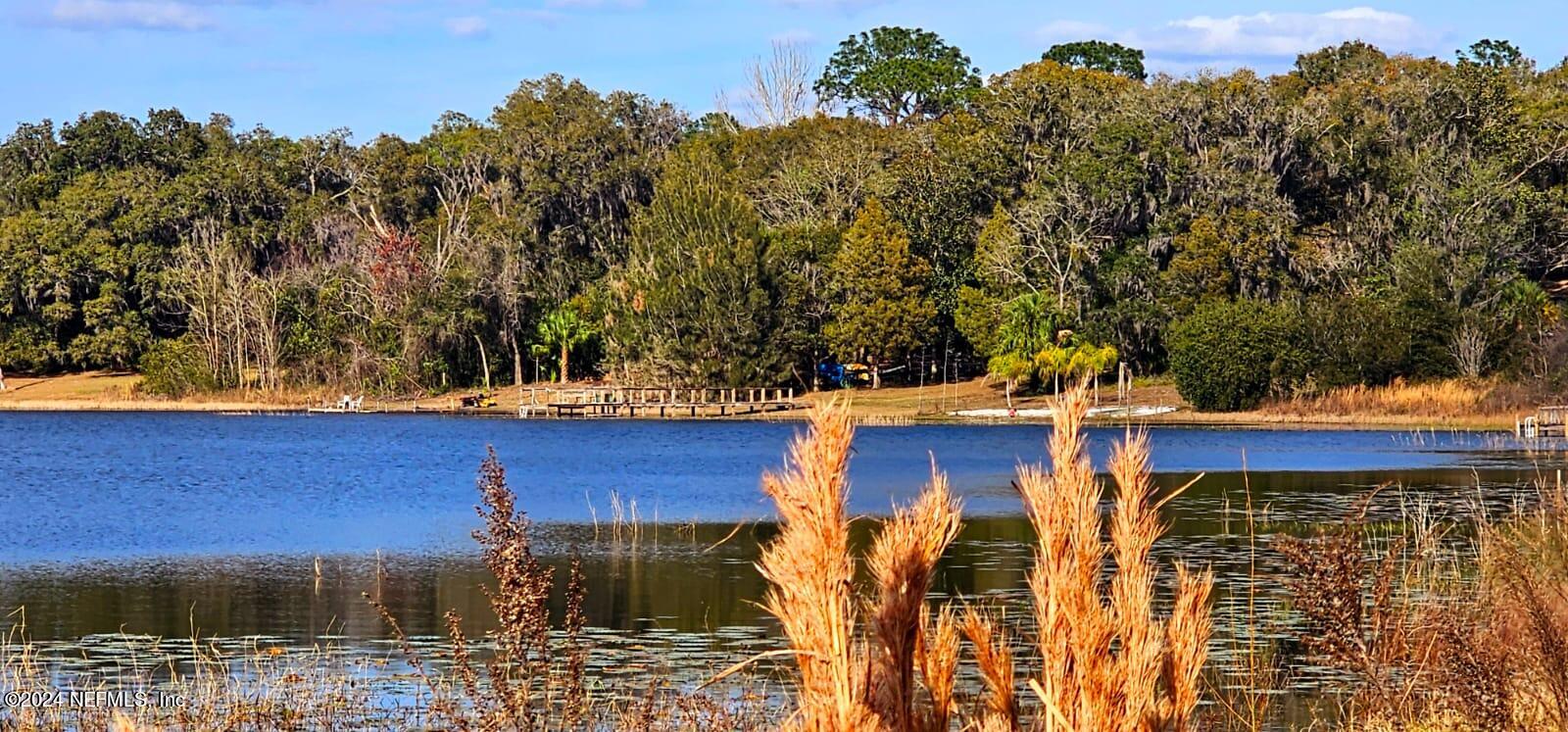 0 Lily Trail Interlachen, FL 32148 - Photo 14 of 22 a view of a wooden house with a yard