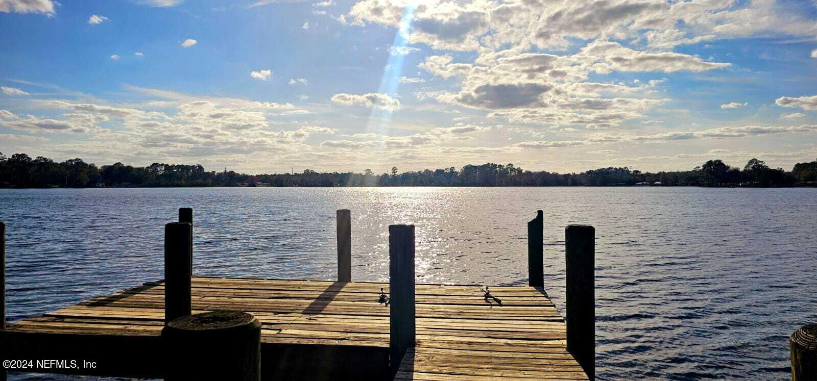 0 Lily Trail Interlachen, FL 32148 - Photo 20 of 22 a view of a terrace with wooden floor and fence