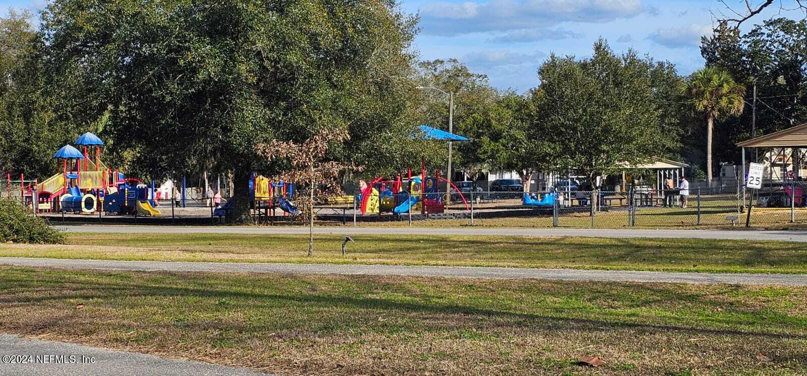 0 Lily Trail Interlachen, FL 32148 - Photo 22 of 22 a view of a swimming pool with an outdoor space and seating area