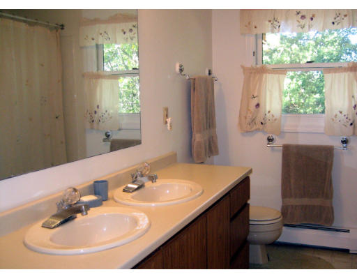 55 Staniford Street Newton, MA 02466 - Photo 14 of 17 a bathroom with a sink and a mirror