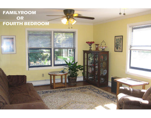 55 Staniford Street Newton, MA 02466 - Photo 7 of 17 a living room with furniture and a window