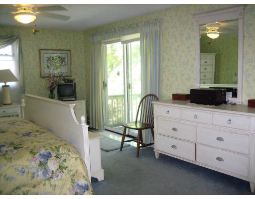 55 Staniford Street Newton, MA 02466 - Photo 10 of 17 a spacious bedroom with a bed and a dresser