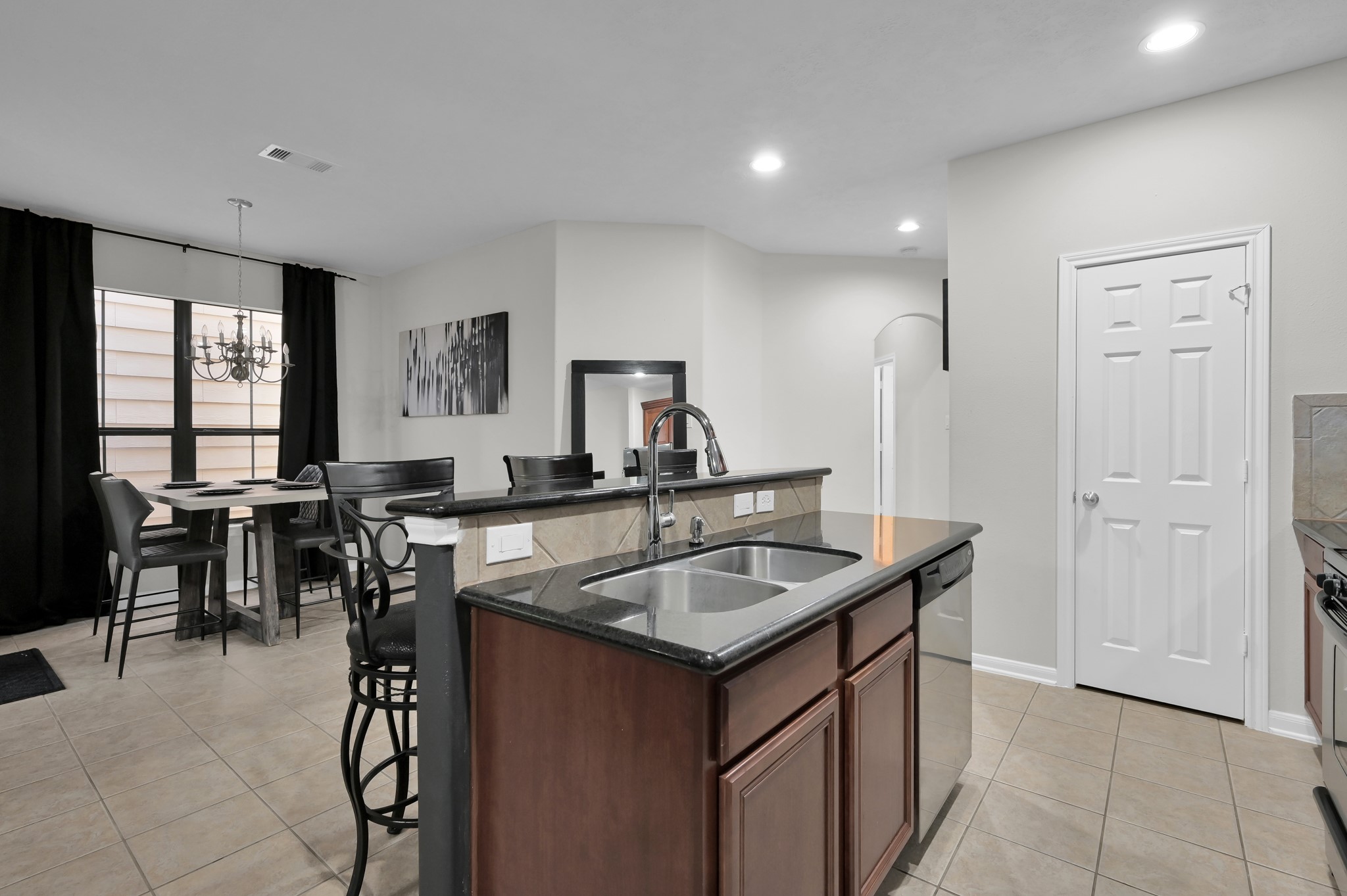 3607 Cedar Flats Lane Spring, TX 77386 - Photo 11 of 41 a kitchen that has a sink a table and chairs in it