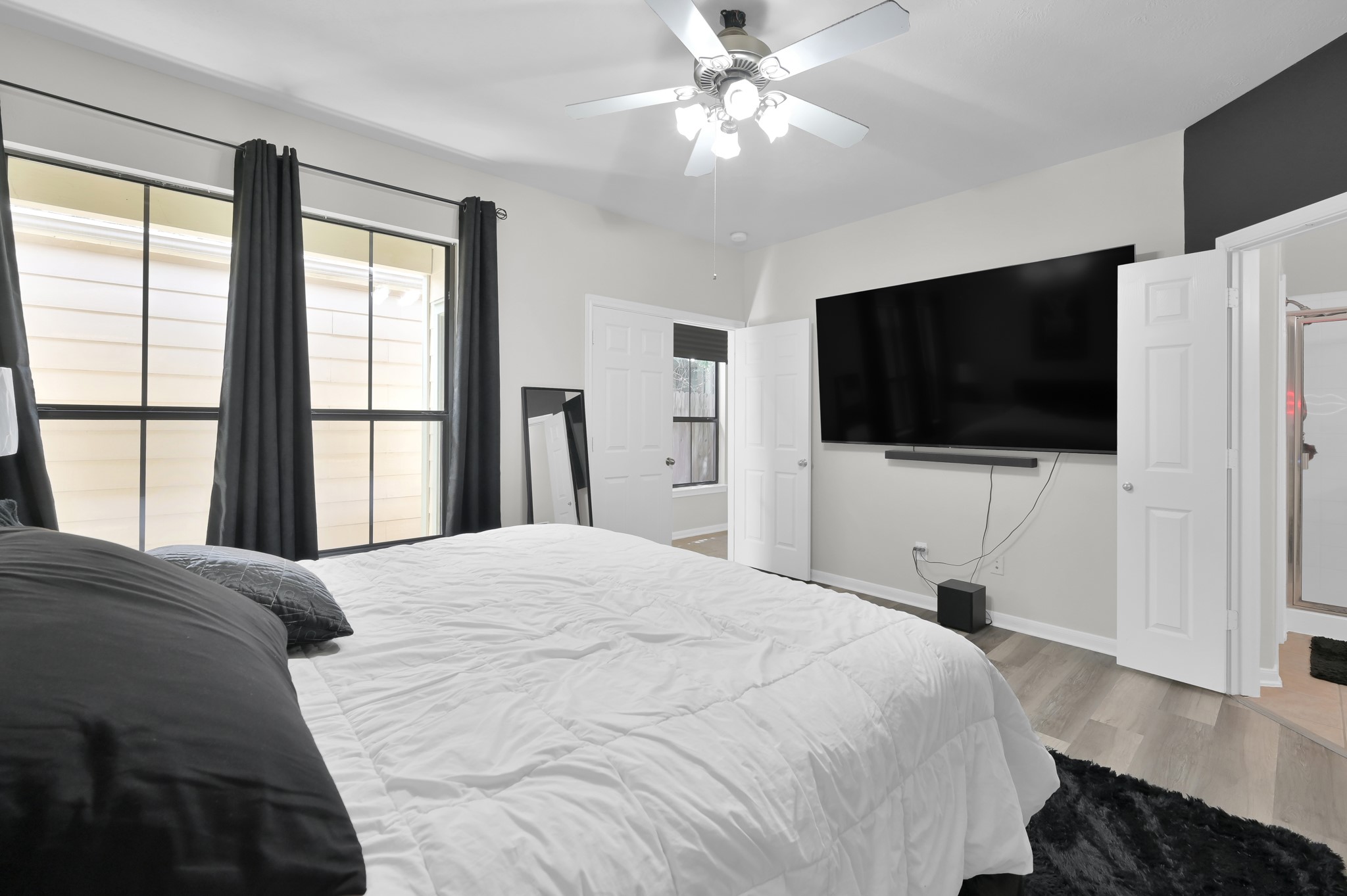 3607 Cedar Flats Lane Spring, TX 77386 - Photo 14 of 41 a bedroom with a bed tv and a window