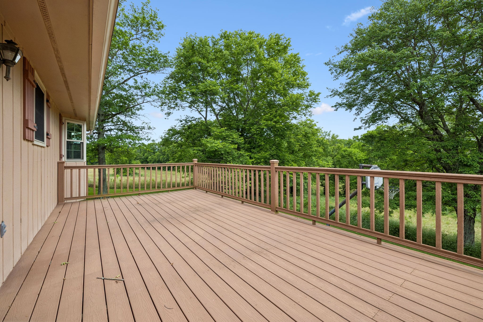 20 Riverbend Lane Carthage, TN 37030 - Photo 45 of 71 a balcony with wooden floor and trees in the back