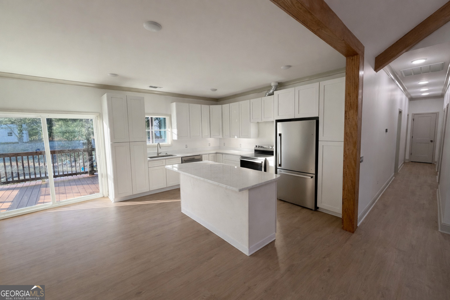 1337 Wildflower Circle Metter, GA 30439 - Photo 2 of 13 a kitchen with stainless steel appliances a refrigerator and a stove top oven