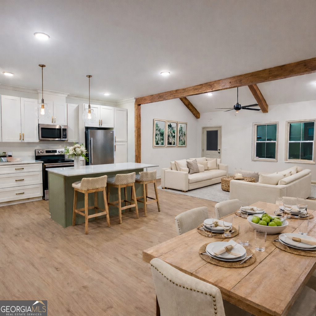 1337 Wildflower Circle Metter, GA 30439 - Photo 6 of 13 a large kitchen with a table and chairs