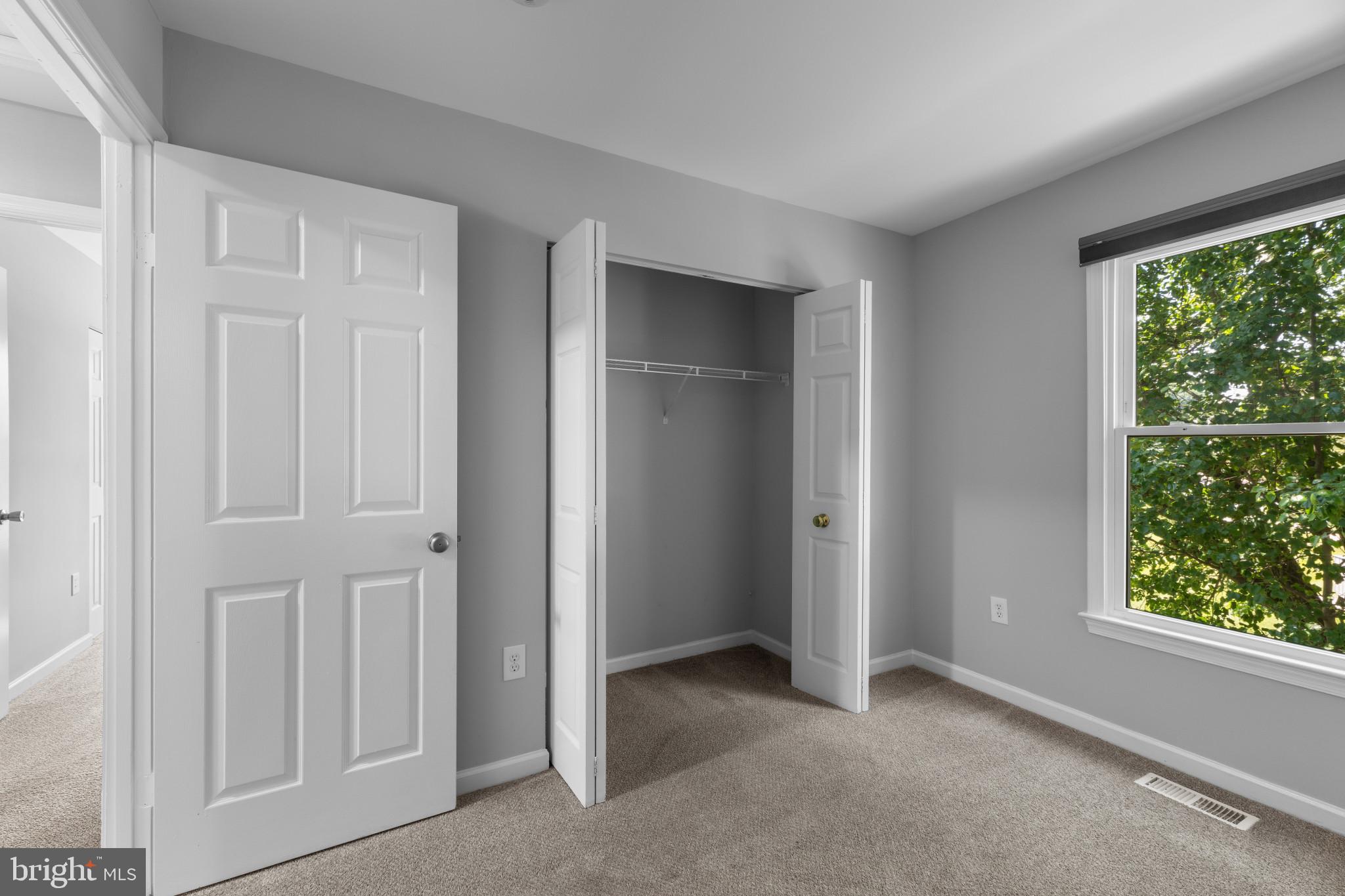 9302 Player Drive, Unit 155 Laurel, MD 20708 - Photo 31 of 43 a view of an empty room with a window