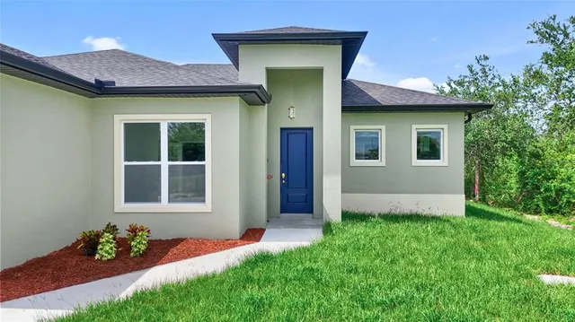 a front view of a house with a yard