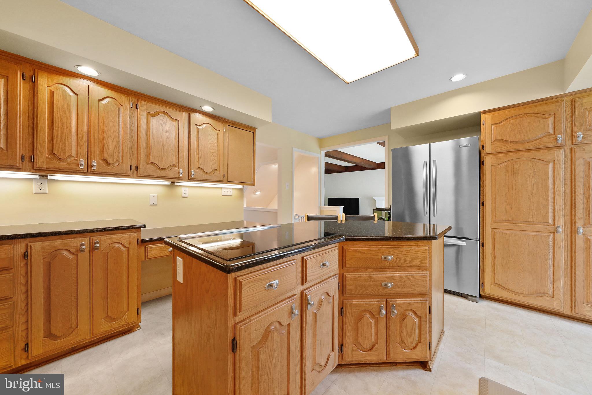 716 Liberty Road Mount Laurel, NJ 08054 - Photo 11 of 51 a kitchen with granite countertop a sink stove and refrigerator