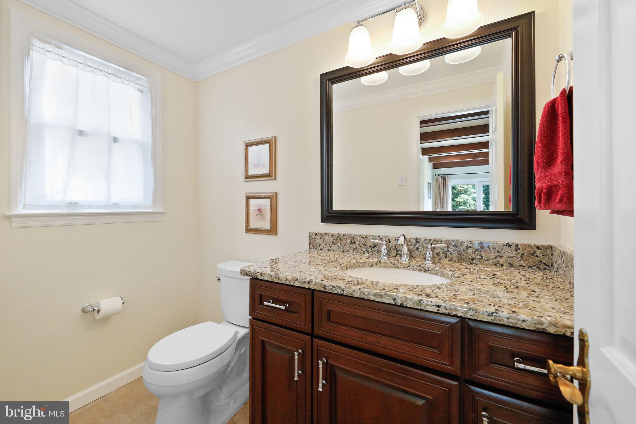 716 Liberty Road Mount Laurel, NJ 08054 - Photo 16 of 51 a bathroom with a granite countertop sink a toilet and a mirror