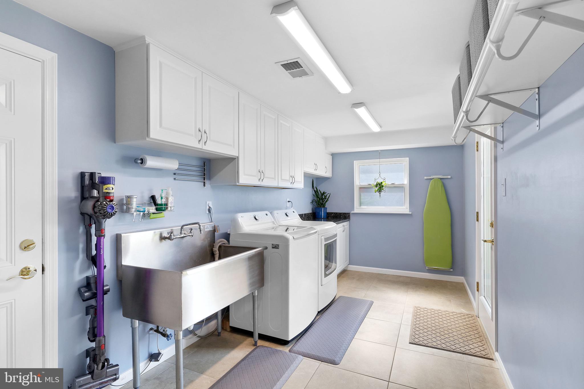716 Liberty Road Mount Laurel, NJ 08054 - Photo 20 of 51 a kitchen with refrigerator and cabinets