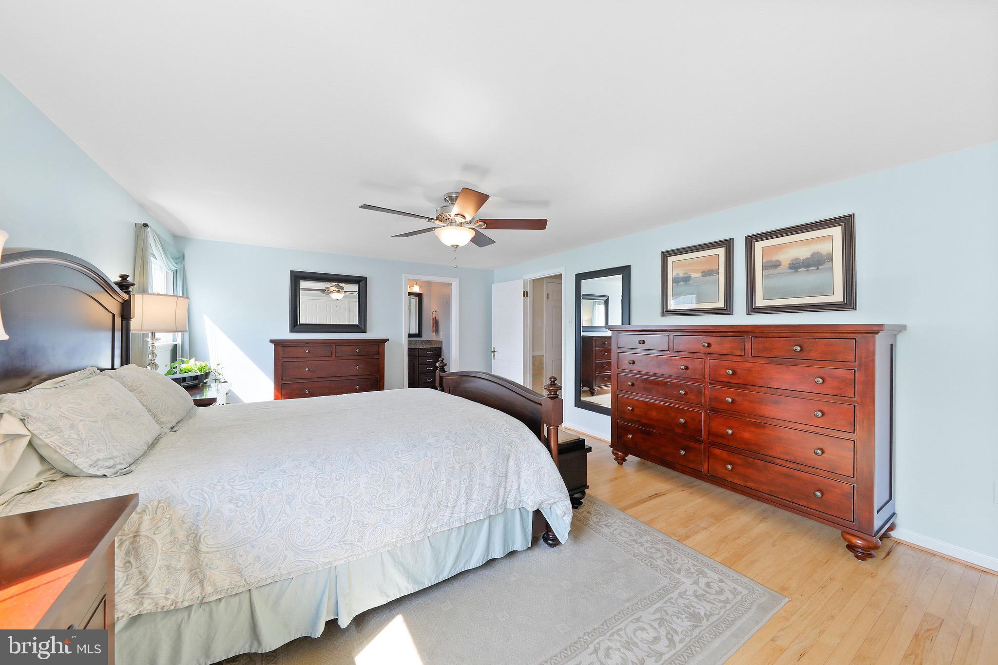 716 Liberty Road Mount Laurel, NJ 08054 - Photo 22 of 51 a bedroom with a bed and wooden floor