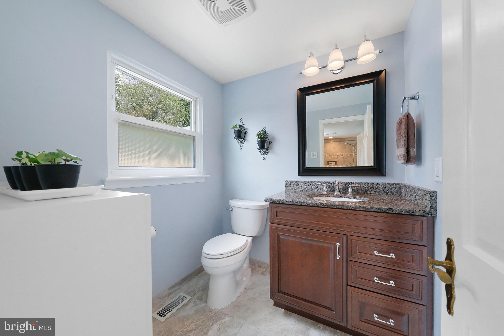 716 Liberty Road Mount Laurel, NJ 08054 - Photo 26 of 51 a bathroom with a toilet a sink a vanity and mirror