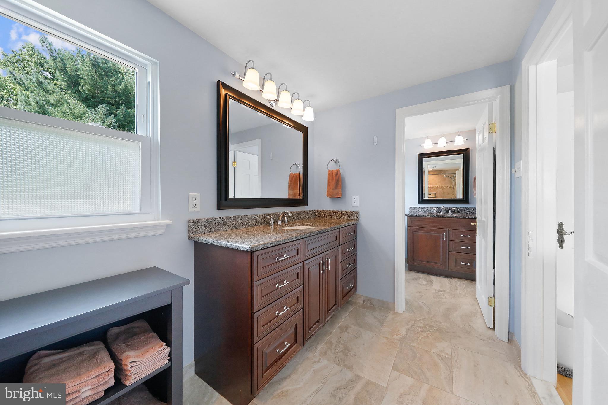 716 Liberty Road Mount Laurel, NJ 08054 - Photo 27 of 51 a bathroom with a sink a mirror and a window